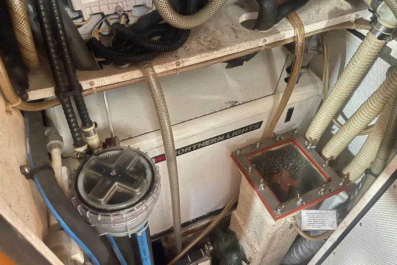 Slide: The Image of Engine room of 2008 Caliber 47 LRC with Northern Lights generator and hoses. - 72