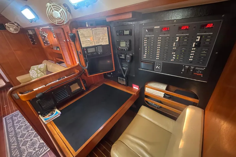 Slide: The Image of Navigation station of 2008 Caliber 47 LRC yacht with control panels and seating. - 77