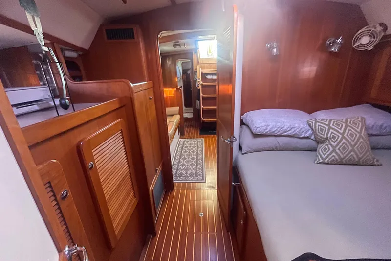 Slide: The Image of Interior of 2008 Caliber 47 LRC yacht with cozy cabin and wooden finishes. - 78