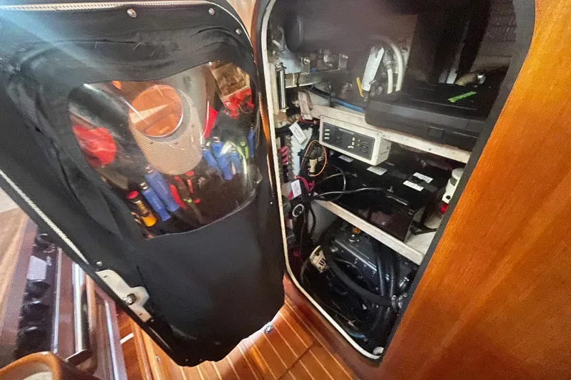 Slide: The Image of 2008 Caliber 47 LRC engine room with tools and electrical components. - 81