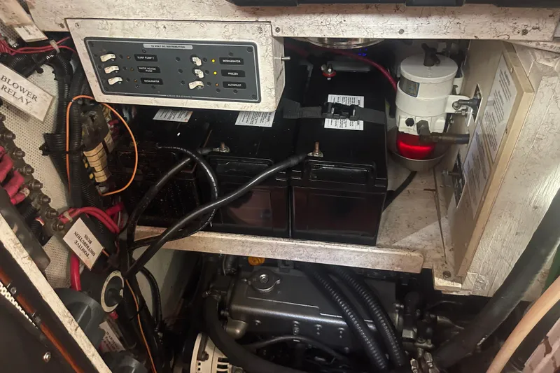 Slide: The Image of Engine compartment of 2008 Caliber 47 LRC with batteries and control panel. - 83