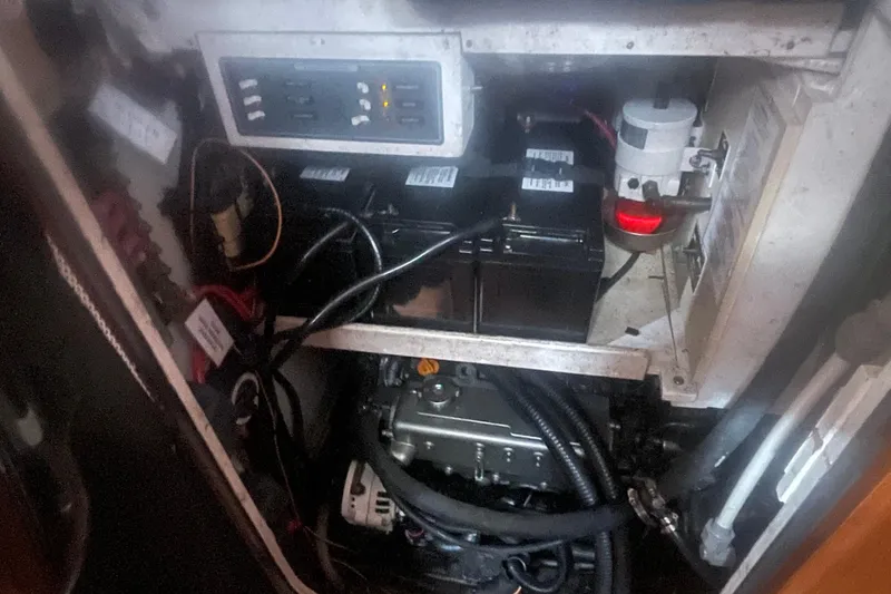 Slide: The Image of Engine compartment of a 2008 Caliber center cockpit cutter with visible wiring and components. - 84