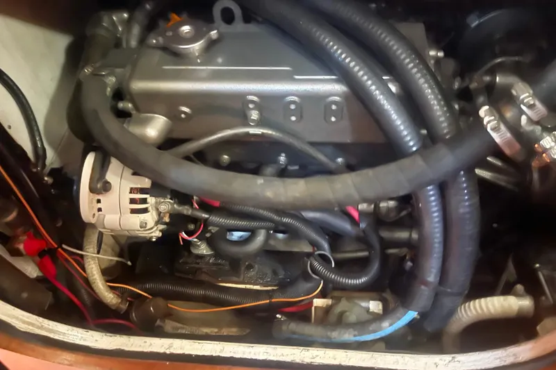 Slide: The Image of Engine compartment of a 2008 Caliber 47 LRC with visible hoses and wiring. - 85