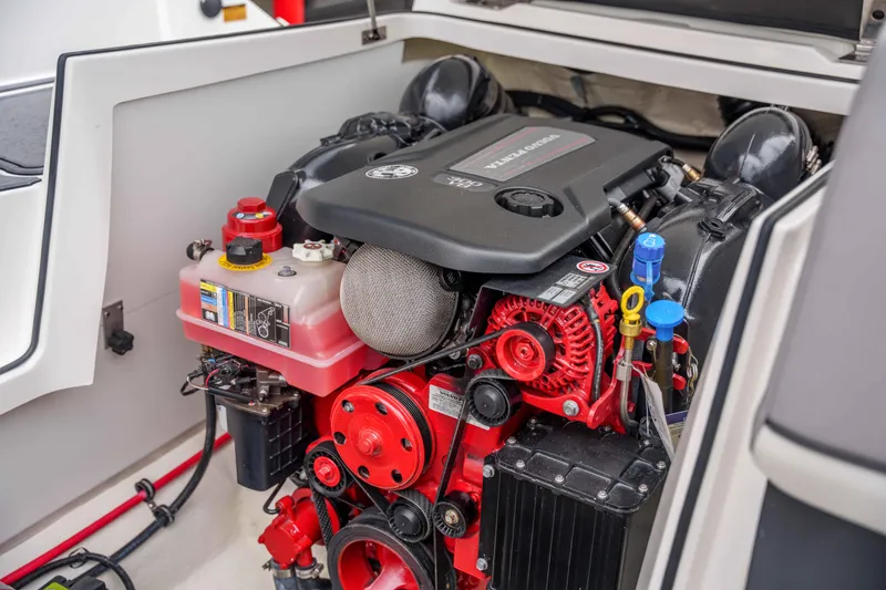 Slide: The Image of 2026 Cobalt CS22 boat engine compartment with detailed components and vibrant colors. - 18