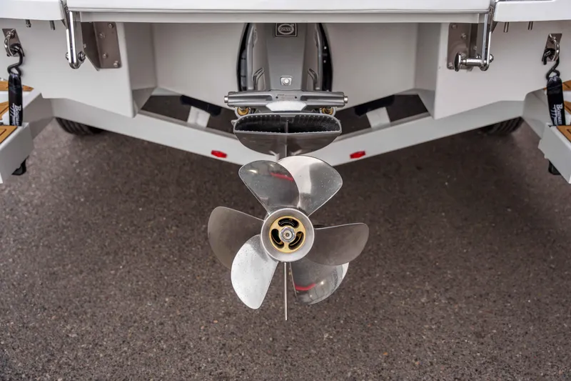Slide: The Image of 2026 Cobalt CS22 boat propeller and stern detail on pavement. - 22
