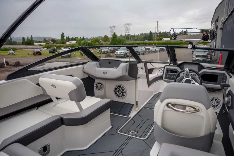 Slide: The Image of Interior of a 2026 Cobalt CS22 boat, featuring modern seating and dashboard design. - 6