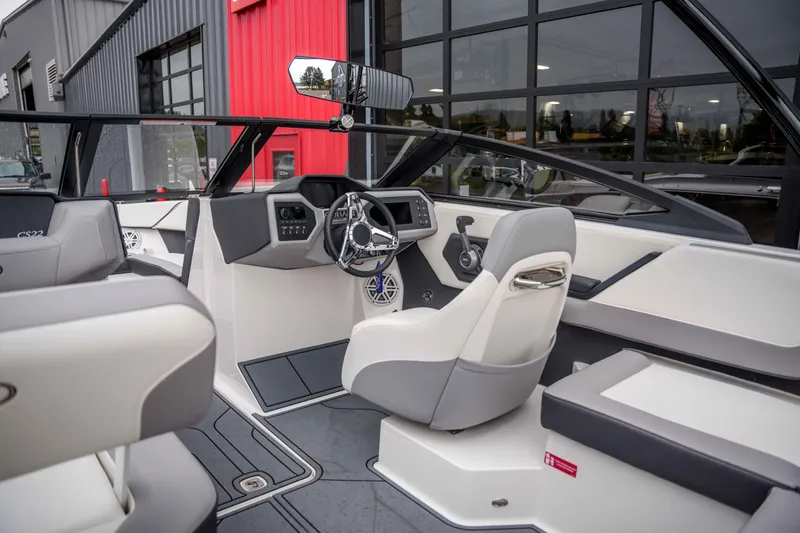 Slide: The Image of 2026 Cobalt CS22 boat interior with modern dashboard and steering wheel design. - 7