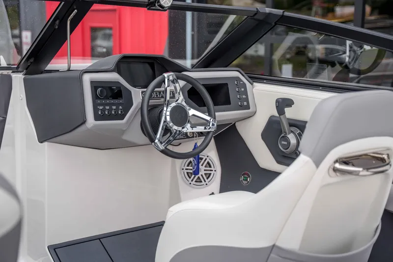 Slide: The Image of Interior of 2026 Cobalt CS22 boat featuring modern steering and controls. - 9