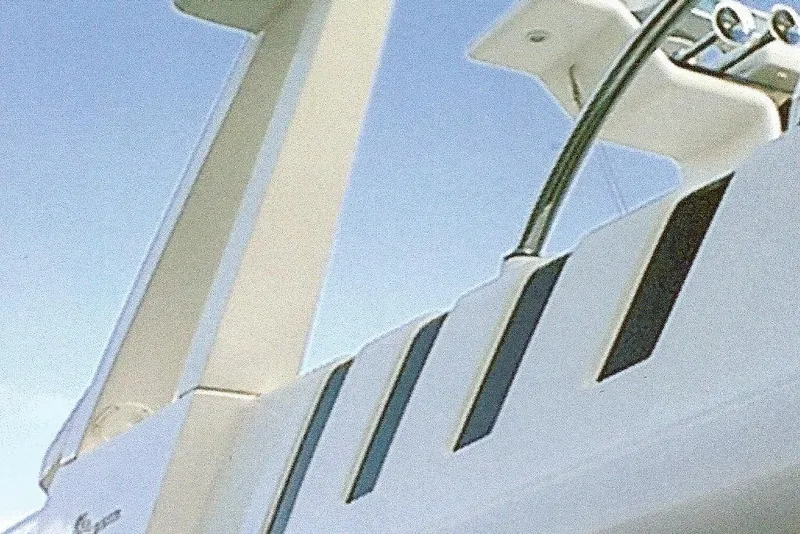 Slide: The Image of Close-up of Dyna Laguna yacht exterior against clear blue sky. - 16
