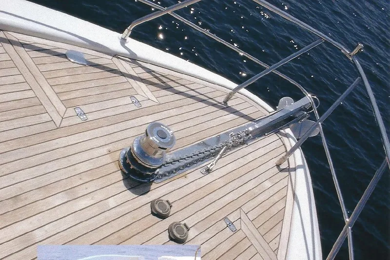 Slide: The Image of Bow of Dyna Laguna yacht with anchor chain and wooden deck. - 23