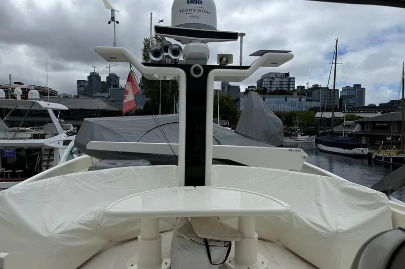 Slide: The Image of Dyna Laguna boat docked in marina with city skyline in background. - 25