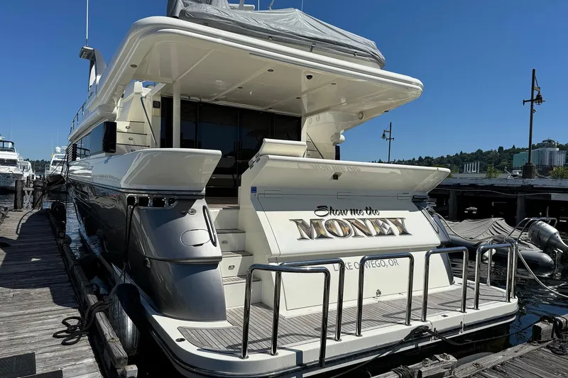 Slide: The Image of Luxury yacht "Show Me the Money" docked, Dyna Laguna model, sunny day. - 3