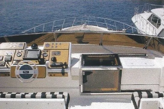 Slide: The Image of Cockpit view of Dyna Laguna yacht with navigation controls and ocean backdrop. - 30
