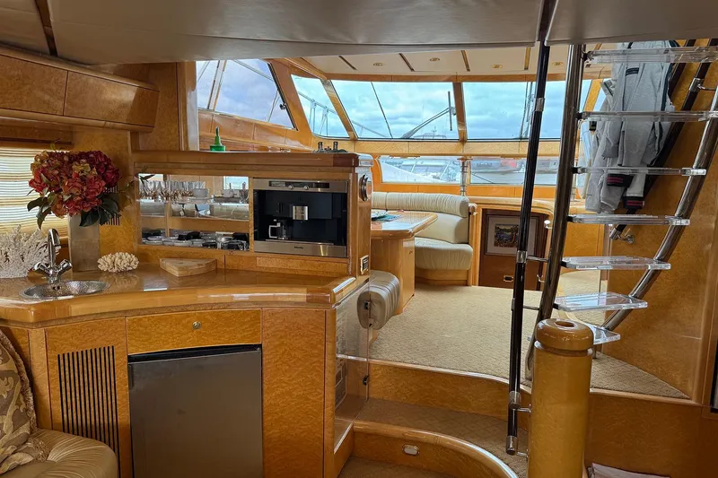 Slide: The Image of Luxurious Dyna Laguna yacht interior with modern kitchen, dining area, and elegant staircase. - 36