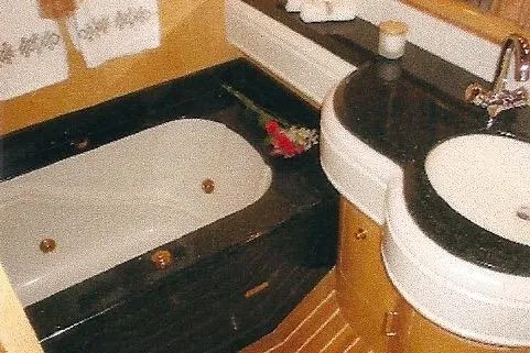 Slide: The Image of Luxurious Dyna Laguna bathroom with elegant bathtub and modern sink design. - 55