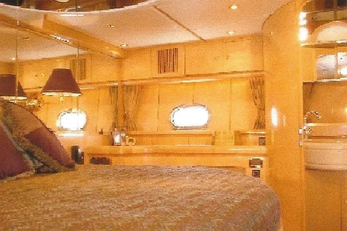 Slide: The Image of Luxurious Dyna Laguna yacht interior with elegant wood finishes and ambient lighting. - 57