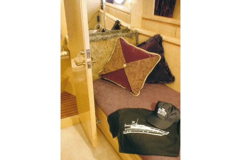 Slide: The Image of Luxurious Dyna Laguna yacht cabin with plush pillows and branded apparel. - 61