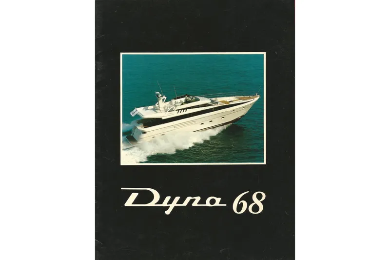 Slide: The Image of Luxury yacht Dyna Laguna cruising on the ocean, featured on a black brochure cover. - 76