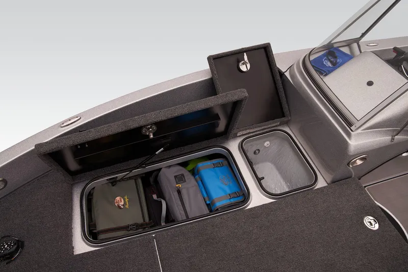 Slide: The Image of 2026 Triton 206 Allure boat interior with seating and storage compartments. - 12