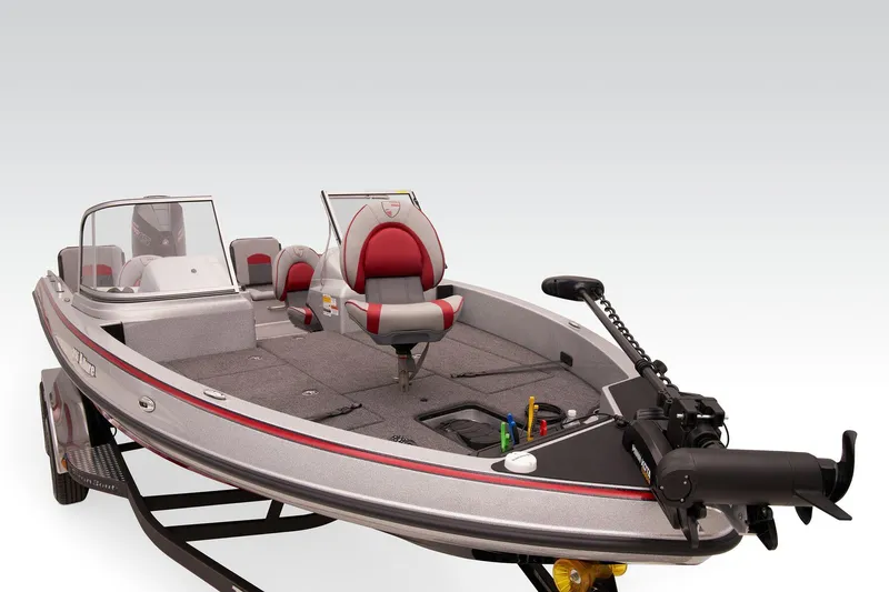 Slide: The Image of 2026 Triton 206 Allure boat interior with gray carpet and fishing equipment. - 8