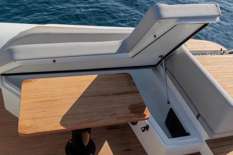 Slide: The Image of Luxury seating and table on 2026 Rock Marine RM 40 yacht, overlooking the ocean. - 15