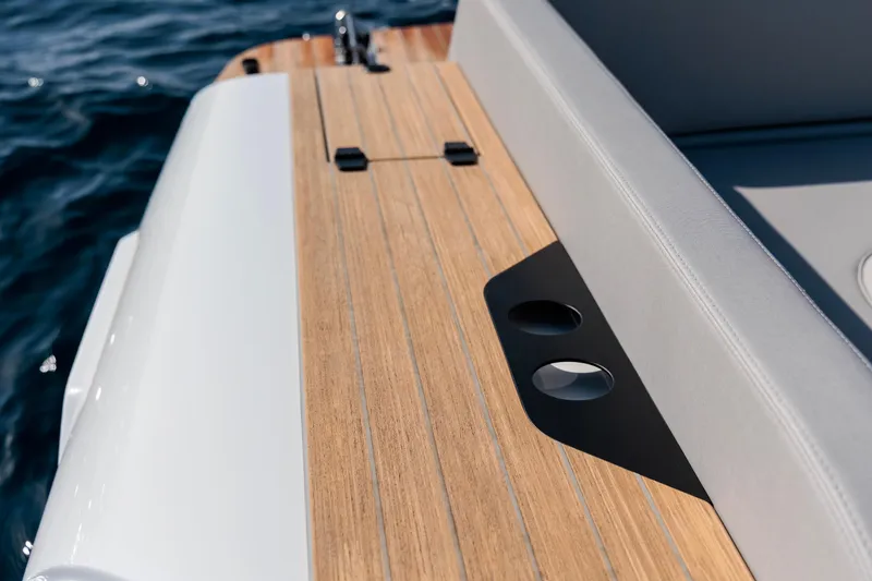 Slide: The Image of 2026 Rock Marine RM 40 boat deck with sleek wood finish and ocean backdrop. - 16
