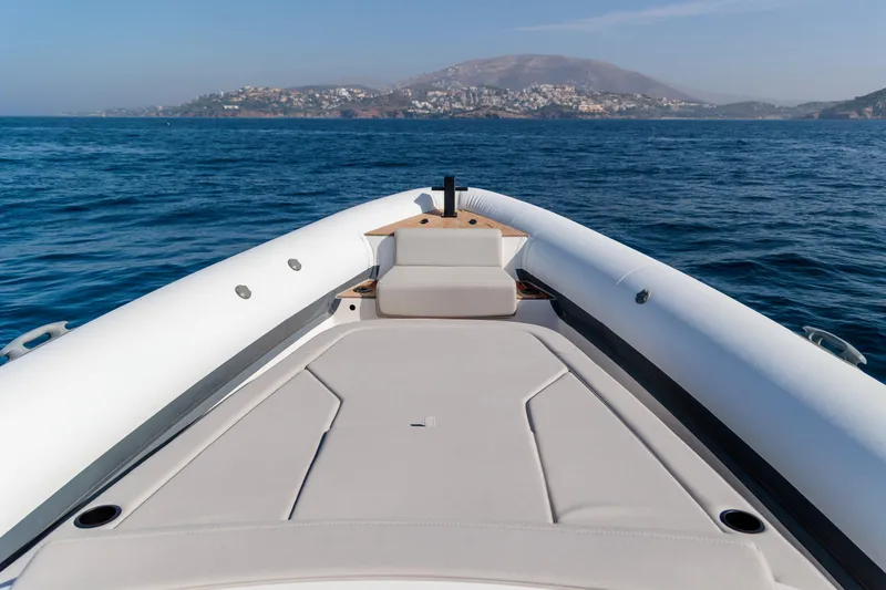 Slide: The Image of 2026 Rock Marine RM 40 boat cruising on open sea with scenic coastal view. - 17