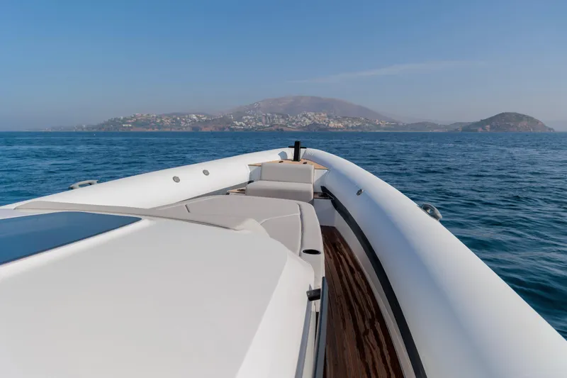 Slide: The Image of 2026 Rock Marine RM 40 boat cruising on open sea with scenic coastal view. - 18