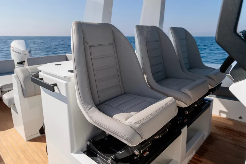 Slide: The Image of Luxury seating on 2026 Rock Marine RM 40 boat, featuring modern design and ocean backdrop. - 23