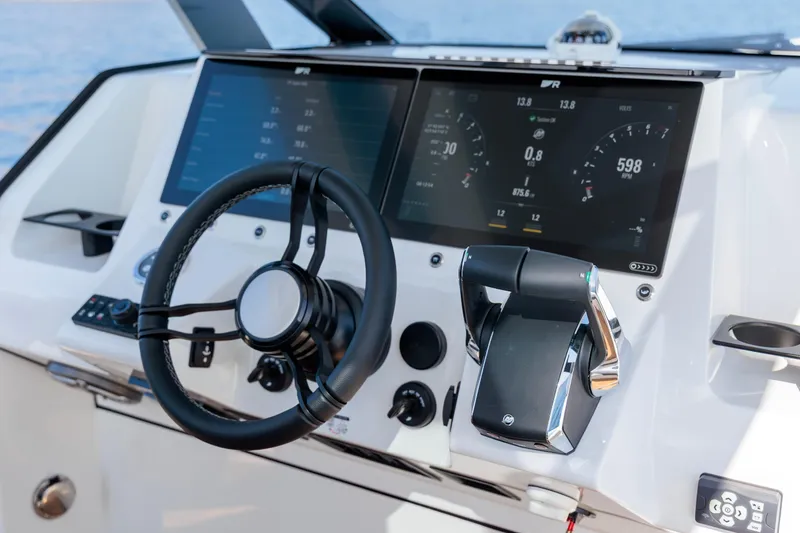 Slide: The Image of 2026 Rock Marine RM 40 boat dashboard with modern steering and digital displays. - 25