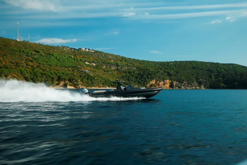 Slide: The Image of 2026 Rock Marine RM 40 speeding on blue water near lush green coastline. - 3