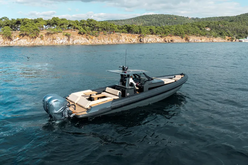 Slide: The Image of 2026 Rock Marine RM 40 boat cruising on scenic coastal waters. - 5