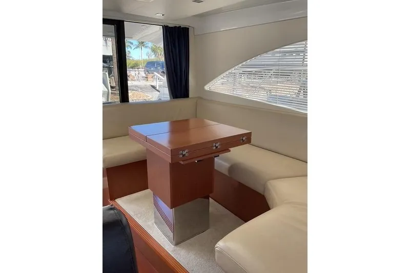 Slide: The Image of Luxurious interior of 2014 Beneteau Gran Turismo 49 yacht with elegant seating and table. - 11