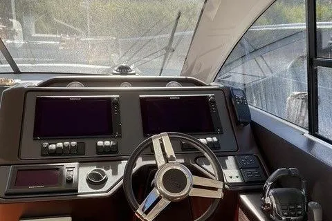 Slide: The Image of Cockpit of 2014 Beneteau Gran Turismo 49 yacht with dual navigation screens. - 13