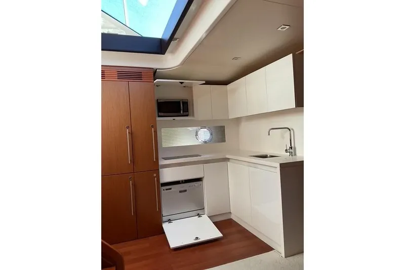 Slide: The Image of Modern kitchen interior of 2014 Beneteau Gran Turismo 49 yacht with sleek cabinetry. - 16
