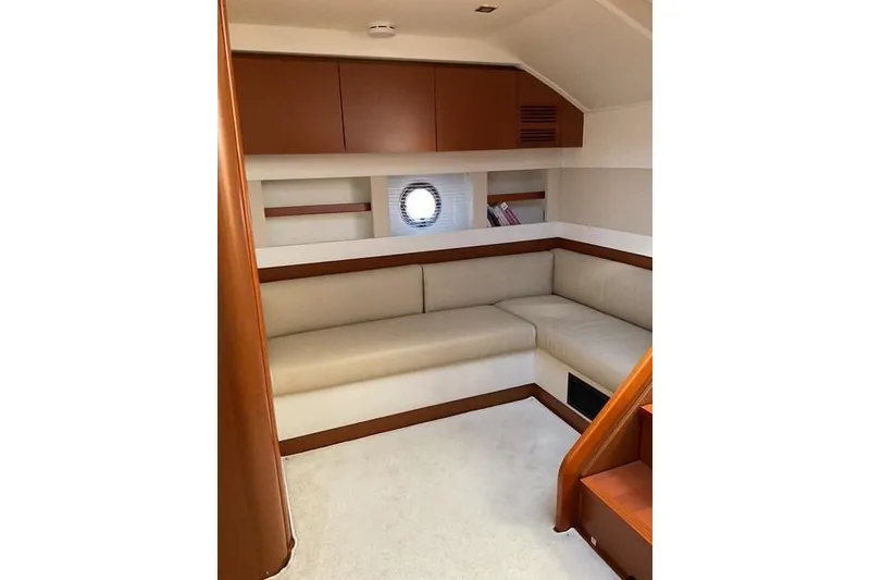 Slide: The Image of Interior of 2014 Beneteau Gran Turismo 49 yacht with beige seating and wooden accents. - 19