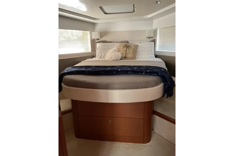 Slide: The Image of Luxurious bedroom interior of 2014 Beneteau Gran Turismo 49 yacht with cozy bedding. - 22