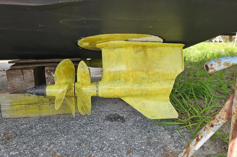 Slide: The Image of Close-up of a 2014 Beneteau Gran Turismo 49 boat propeller on a stand. - 36