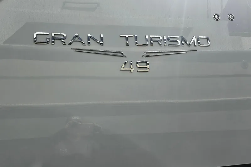 Slide: The Image of 2014 Beneteau Gran Turismo 49 yacht emblem on hull, showcasing model name. - 39