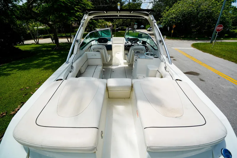 Slide: The Image of 2010 Sea Ray 270 SLX boat interior with white seating and open deck layout. - 7