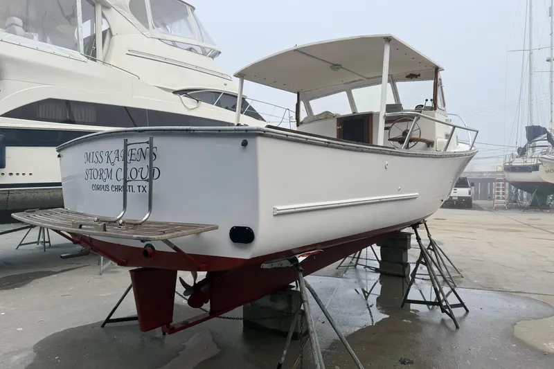 Slide: The Image of 1983 SISU 26 boat named "Miss Karen's Storm Cloud" on dry dock in Corpus Christi, TX. - 9