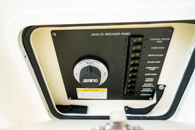 Slide: The Image of Main DC breaker panel on 2015 Sea Ray 260 Sundancer boat, featuring various control switches. - 32