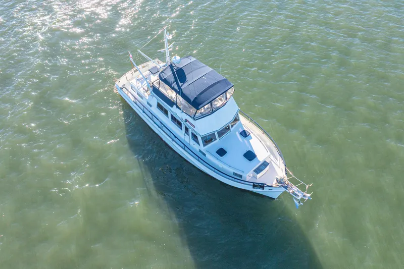 Slide: The Image of Aerial view of 1989 Grand Banks 46 Classic yacht on calm water. - 13