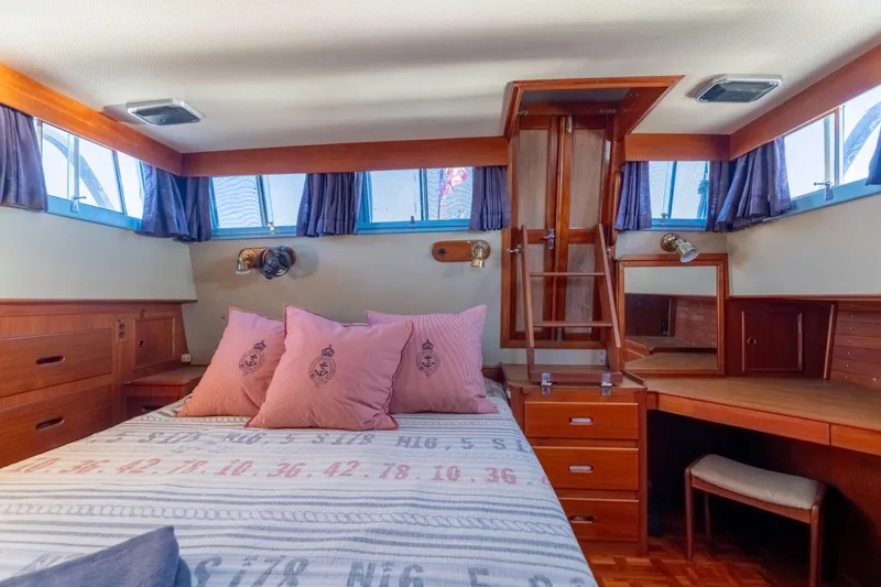 Slide: The Image of Cozy cabin interior of 1989 Grand Banks 46 Classic yacht with wooden furnishings and nautical decor. - 27