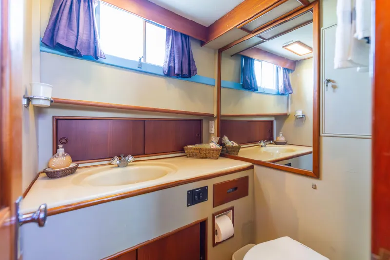 Slide: The Image of Bathroom interior of 1989 Grand Banks 46 Classic yacht with mirror and sink. - 33