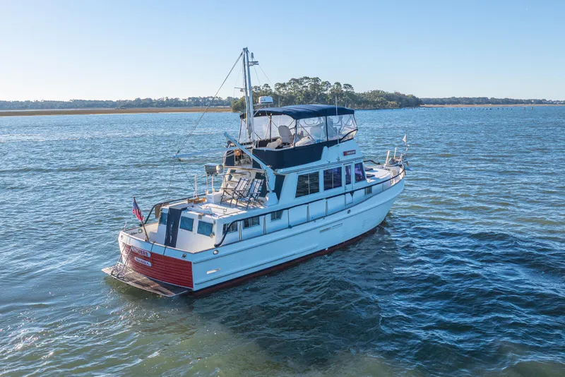 Slide: The Image of 1989 Grand Banks 46 Classic yacht cruising on a serene waterway. - 4