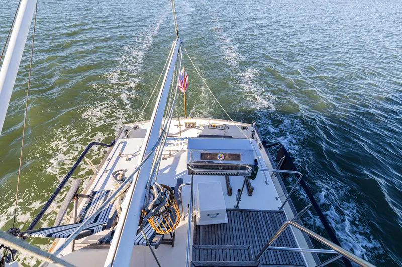 Slide: The Image of 1989 Grand Banks 46 Classic yacht cruising on open water, rear deck view. - 41