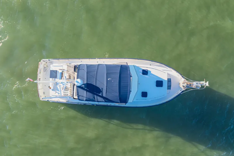 Slide: The Image of Aerial view of 1989 Grand Banks 46 Classic yacht on calm green water. - 5