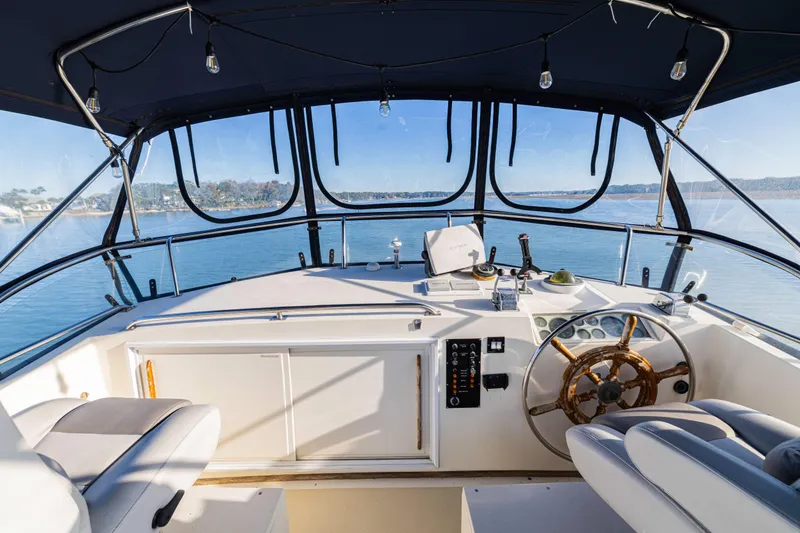 Slide: The Image of 1989 Grand Banks 46 Classic yacht helm with panoramic water view. - 57