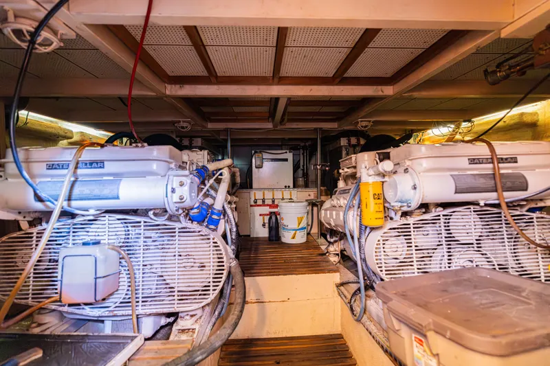 Slide: The Image of Engine room of 1989 Grand Banks 46 Classic yacht with dual Caterpillar engines. - 61